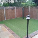 after 4 - levelled lawn with astro turf and new fence